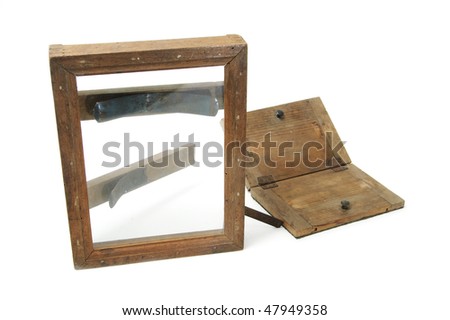 an ancient contact print frame isolated on a white background