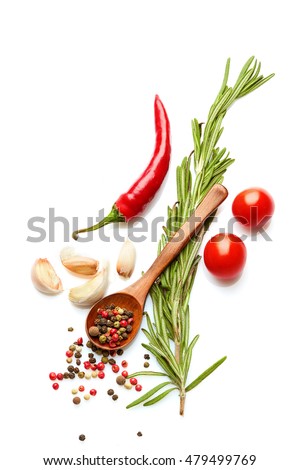 Food and drink healthy lifestyle concept: Italian herbs and spices. Rosemary, tomatoes, garlic and peppers. Top view. Isolated on white.