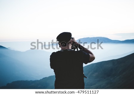 landscape view of great mountains and man silhouette,taking picture of panorama, wild, pro nature concept