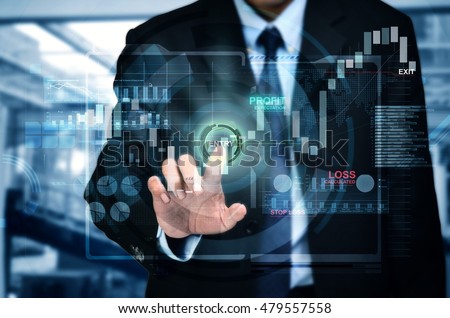A concept of a businessman entering investment market in a touchscreen internet trading platform Royalty-Free Stock Photo #479557558