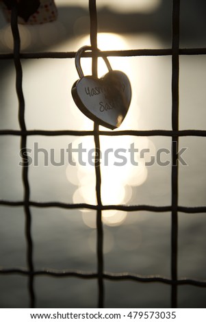 Love padlock on the railing of a bridge, Berlin, Germany.