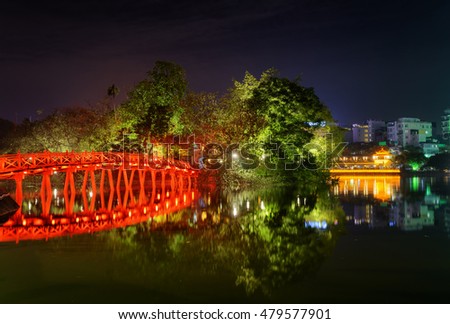 Night view of the Huc Bridge (Morning Sunlight Bridge) reflected in the Hoan Kiem Lake (Lake of the Returned Sword) at historic centre of Hanoi, Vietnam. Royalty-Free Stock Photo #479577901