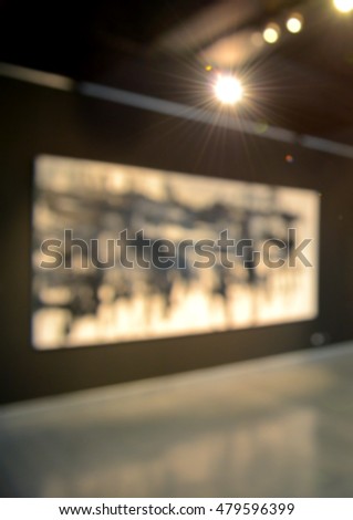 Art exhibition gallery generic background, colourful abstract painting on black background, intentionally blurred post production.