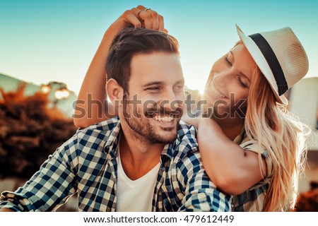Smiling couple in love outdoors Royalty-Free Stock Photo #479612449