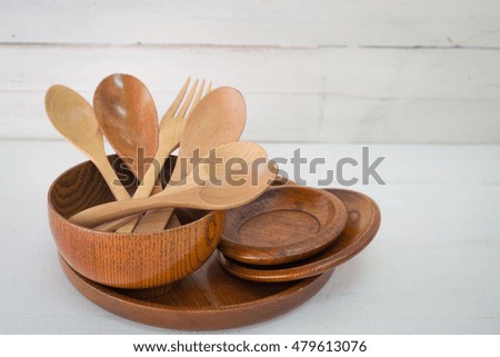 Wood utensils on wood table background. fork and spoon