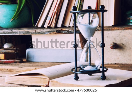 Hourglass in old library