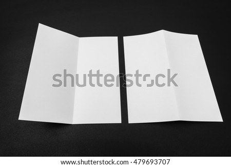 Bifold white template paper on black background