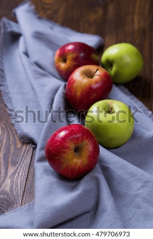 two green apples on the wooden table