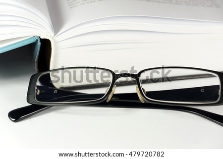 A book and reading glasses