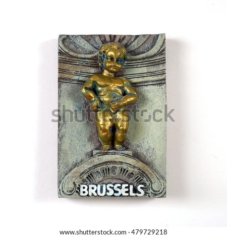 Souvenir from Brussels (Belgium) with the image of the famous fountain with boy "Manneken Pis" isolated on white background