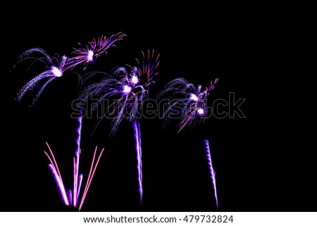 blue and pupple colors fireworks -  beautiful colorful firework isolated display for celebration happy new year and merry christmas on black isolated background