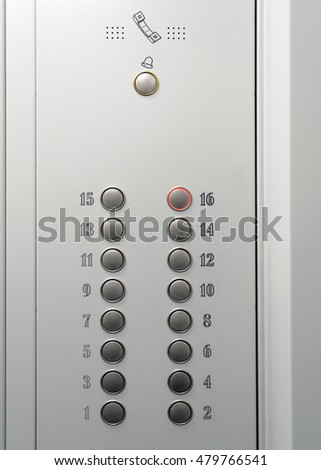 Elevator metal control panel with round buttons with numbers of floors