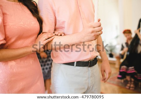 woman  and her husband put gold rings