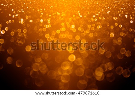Abstract Autumn orange and black glitter sparkle November Thanksgiving background or Fall party invitation for happy Halloween or birthday gala texture Royalty-Free Stock Photo #479871610