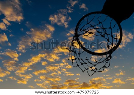 Silhouette of basketball hoop with nice sky background
