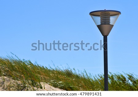 electric lantern on the beach and grass