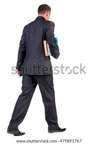 back view of walking  business man with books. going young guy in black suit. Isolated over white background. Rear view people collection. backside view of person