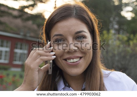 Business young woman phoning mobile phone
