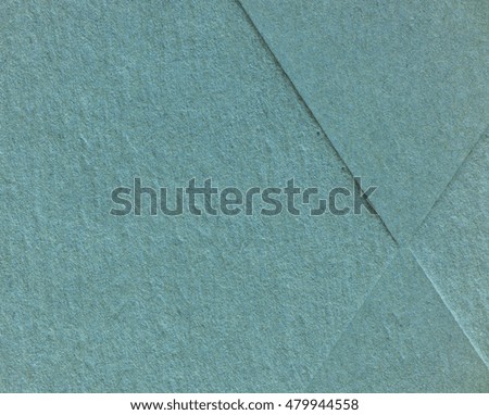 Teal blue and green parchment backdrop.