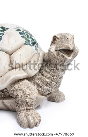 Ceramic figurine of turtle on white background