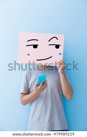 man holding look somewhere and smile expression billboard and take phone isolated on blue background