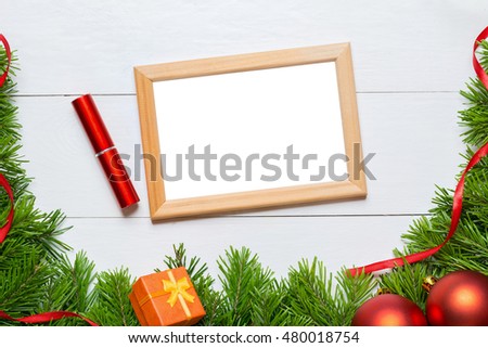 Christmas fir tree with blank photo frame with copy space
