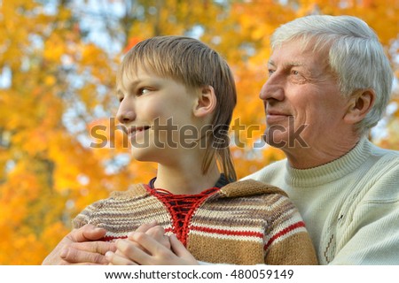 Grandfather and grandson in park