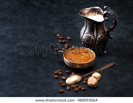 coffee with milk on a black vintage background with space for text