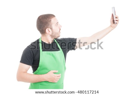 Young supermarket employee taking selfie isolated on white background with copypsace area