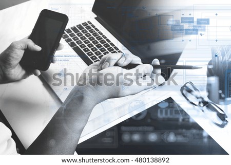 business man hand working on  laptop computer and digital tablet and smart phone on marble desk as concept,black and white  