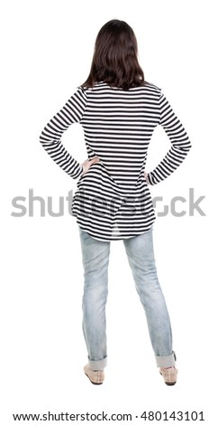 back view of standing young beautiful  brunette woman in striped frock. girl  watching. Rear view people collection.  backside view of person.  Isolated over white background.
