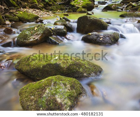 Water going over some rocks in the early morning on Pisgah National Forest