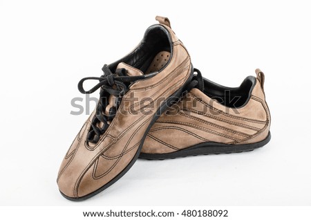 brown  leather shoes on a white background ,old sneaker