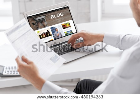 business, blogging, technology and people concept - businessman with internet blog page on laptop computer screen working at office Royalty-Free Stock Photo #480194263