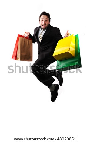  Young attractive businessman jumping with bags in hands