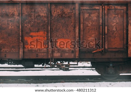 Red rusty train carriage. Industrial background. Vintage effect. 