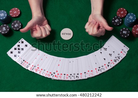 card chips and the player hand at the game table