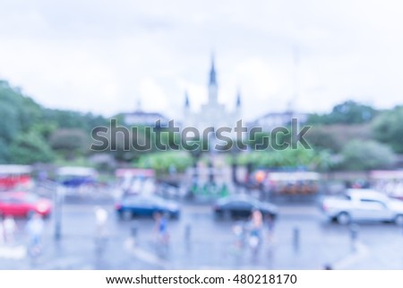 Blurred image of Jackson Square with Jackson's statue and Saint Louis Cathedral. Declared a National Historic Landmark in 1960 for central role in city history and Louisiana Purchase in 1803. Vintage.