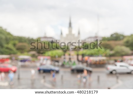 Blurred image of Jackson Square with Jackson's statue and Saint Louis Cathedral. It declared a National Historic Landmark in 1960, as central role in the city's history and Louisiana Purchase in 1803.
