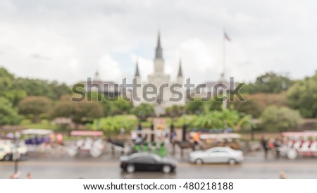 Blurred image of Jackson Square with Jackson's statue and Saint Louis Cathedral. Declared a National Historic Landmark in 1960 for central role in city history and Louisiana Purchase in 1803. Panorama