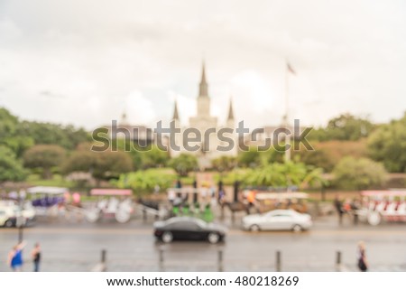 Blurred image of Jackson Square with Jackson's statue and Saint Louis Cathedral. It declared a National Historic Landmark in 1960, as central role in the city's history and Louisiana Purchase in 1803.