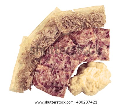 Homemade  Jellied veal, cold cut dish made from veal,  pork, stock, onion and spices, headcheese with slices of pork and beef and grated horseradish on a white background