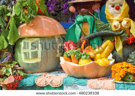 A variety of vegetables: tomatoes, potatoes, carrots, cabbage, parsley, onions, pumpkin, maize presented for sale at the fair in the form of amusing figures.