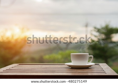 Coffee espresso on wood table nature background in garden,warm tone Royalty-Free Stock Photo #480275149