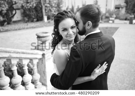 Black and white phoro of lovely bride's hugs