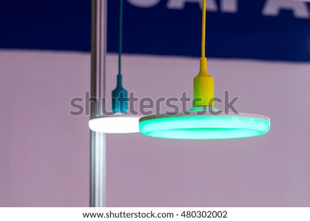 The blue lamp and the white lamp in donut shape.