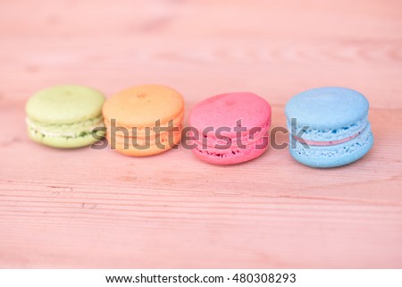 macarons sweet beauty dessert on wood background pink color tone.