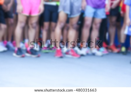 group of marathon runners, abstract blurry picture or city marathon with runners in motion blur