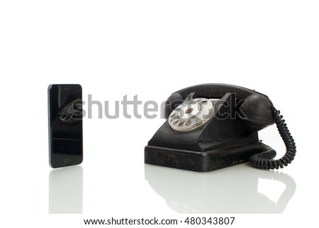 different between old telephone and modern smart phone isolated on white background