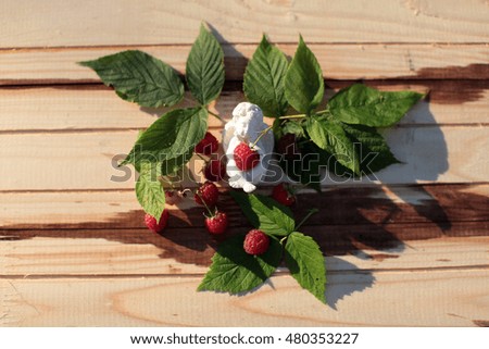 raspberries  on wooden table
